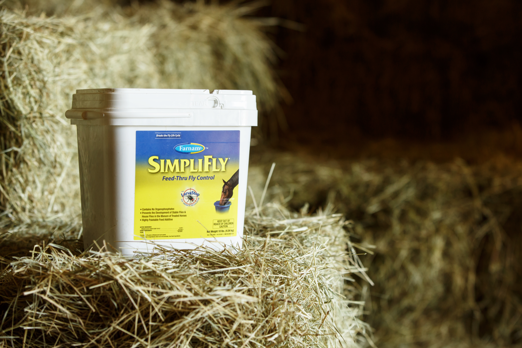 SimpliFly bucket on hay