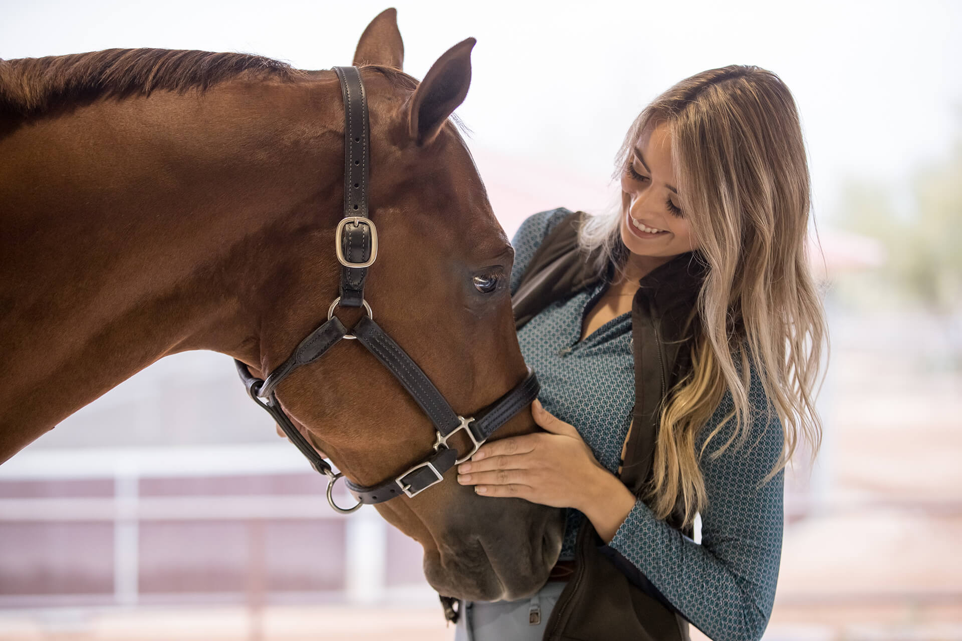 girl looking at horse
